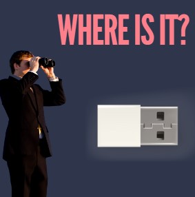 a man looking through binoculars searching for his lost usb drive